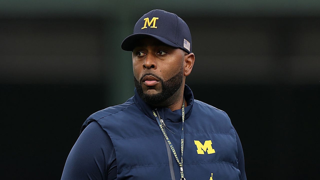 The Wolverines' football coach was fired on Wednesday and was later detained by police.